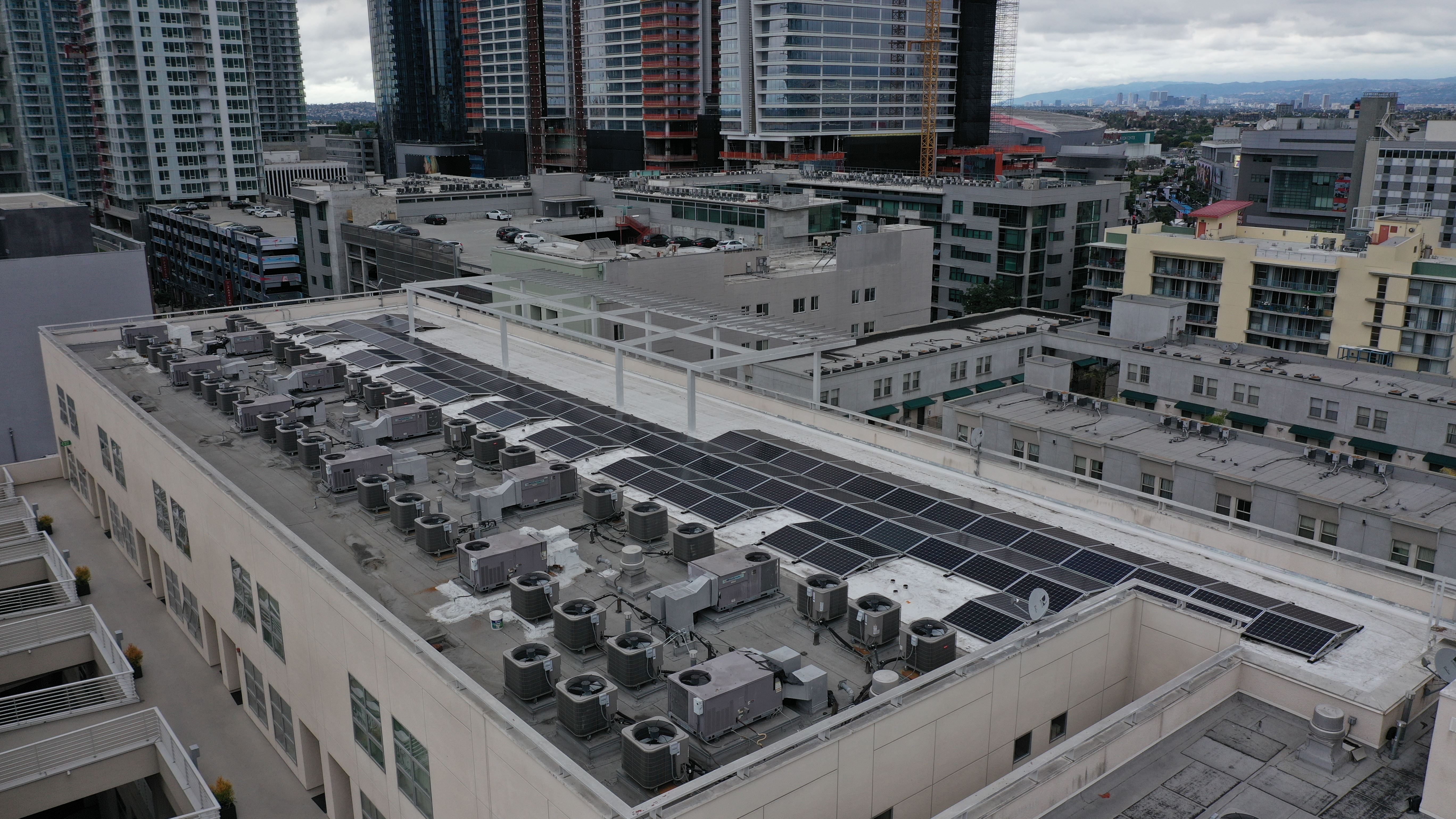 Rooftop solar panels on apartment building.