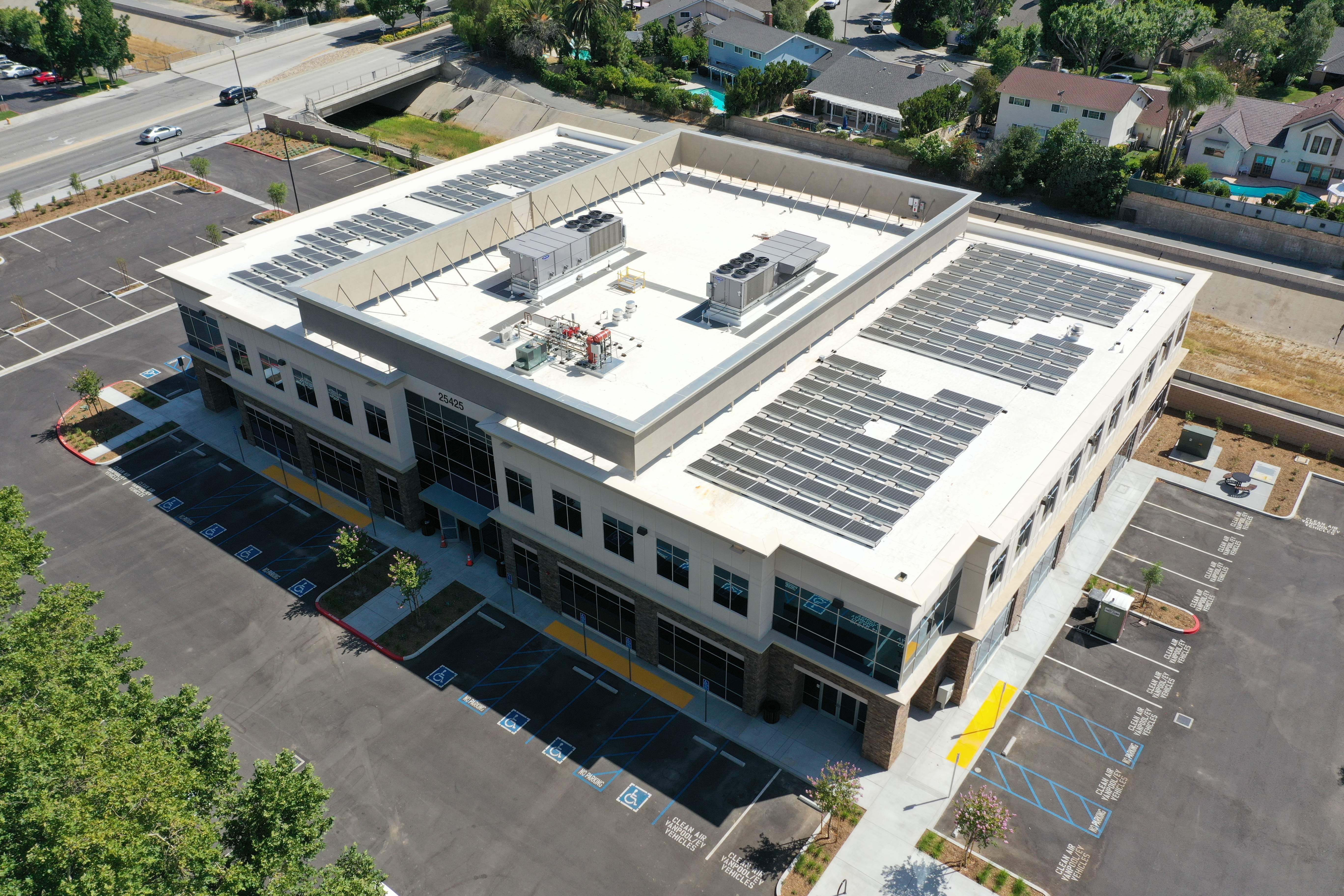 An above view of a rooftop solar system on a commercial building.
