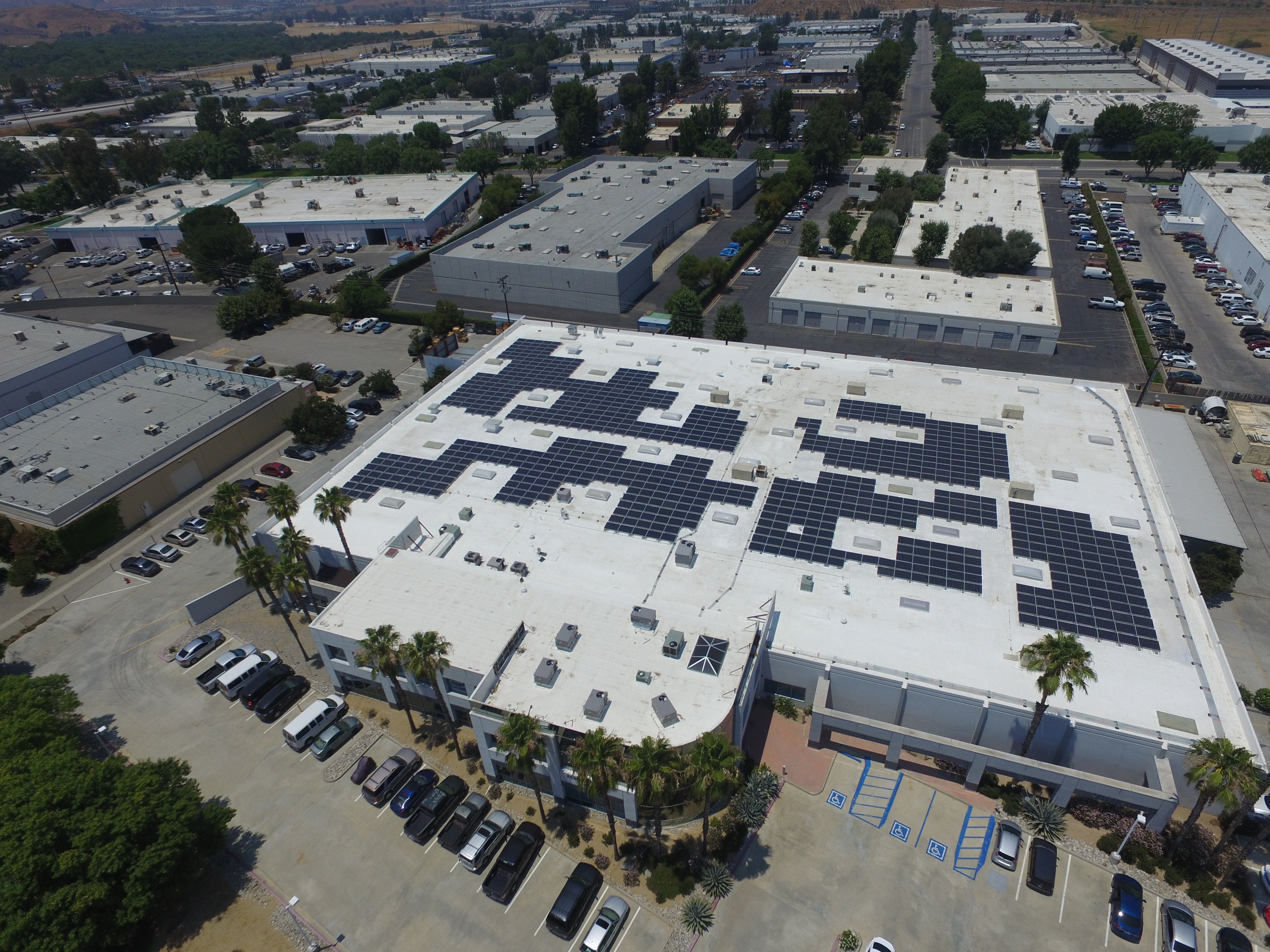 Above view of a rooftop solar system on a commercial building.